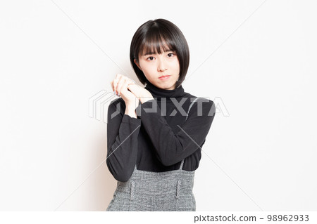young woman asking for a favor 98962933