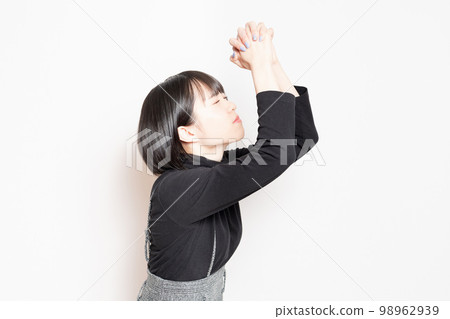 young woman asking for a favor 98962939