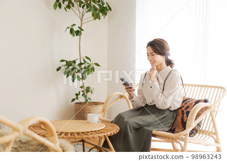 A woman relaxing in the room 98963243