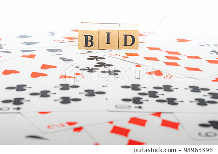 Playing cards and wooden blocks BID 98963396