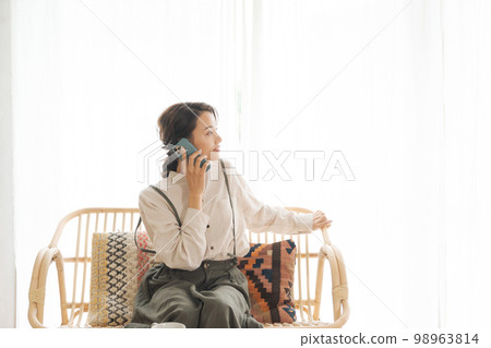 A woman making a phone call A woman making a phone call 98963814