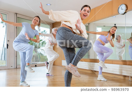 Dynamic young woman dancing hip-hop 98963970