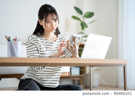 woman suffering from inflation woman suffering from inflation 98966201