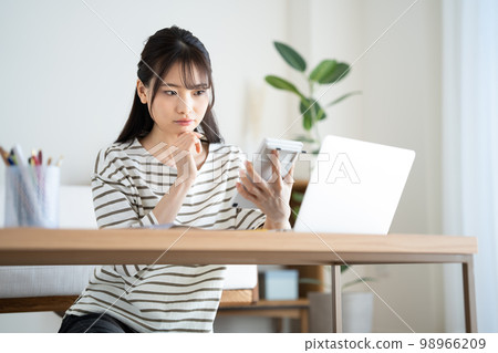 woman suffering from inflation woman suffering from inflation 98966209