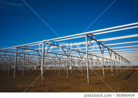 Foundation work for a photovoltaic power plant converted from agricultural land Columns and beams aligned b-2 Highly saturated matte texture Foundation work for a photovoltaic power plant converted from agricultural land Columns and beams aligned b-2 Highly saturated matte texture 98966404