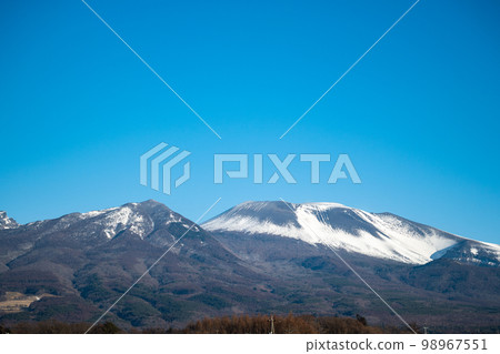 Snow-capped Mount Asama from Saku City 98967551