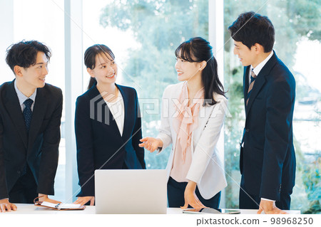 Meeting scene in a bright office Meeting scene in a bright office 98968250