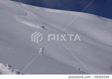 Hokkaido backcountry gliding on a large slope in fine weather 98969396