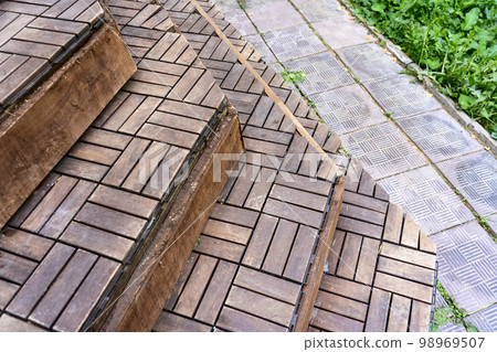 the porch of the house with a decorative covering of stairs in the backyard 98969507