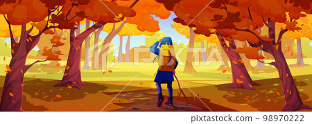 Hiker with backpack walk in autumn forest 98970222