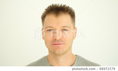 Portrait of young healthy man with stylish haircut 98972579