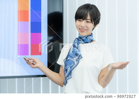 A female lecturer giving a makeup lesson in front of a monitor job hunting makeup business seminar 98972827