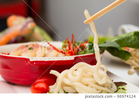 Vietnamese healthy food set; Close up of PHO with sliced pork soup with wooden chopsticks 98974124