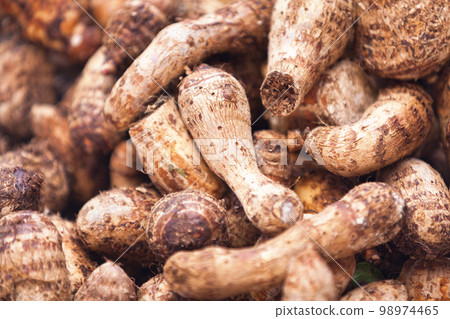 Stack of taro on a market stall Stack of taro on a market stall 98974465