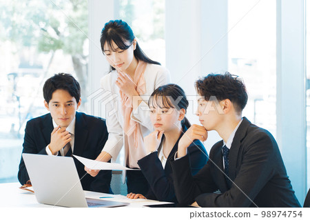 Meeting scene in a bright office Meeting scene in a bright office 98974754