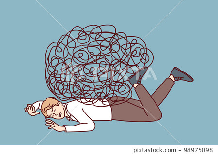 Depressed businessman lies on ground face down under heavy load of tangled lines 98975098