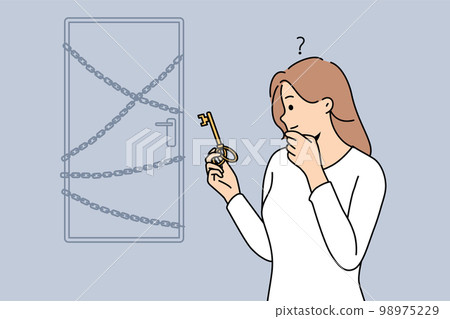 Woman with key stand near locked doors 98975229