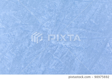 Empty ice rink with skate marks after the session outdoor. Empty ice rink with skate marks after the session outdoor. 98975692