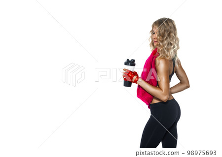 Back view of sport girl with towel on neck who holding sport bottle on white background. Sport Hydration Back view of sport girl with towel on neck who holding sport bottle on white background. Sport Hydration 98975693