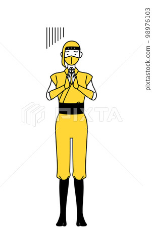 一個穿著忍者服裝的女人雙手合十在身體前道歉 一個穿著忍者服裝的女人雙手合十在身體前道歉 98976103