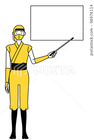 A woman in a ninja costume pointing at a whiteboard with a pointing stick 98976114