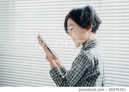 boy obsessed with tablet boy obsessed with tablet 98976361