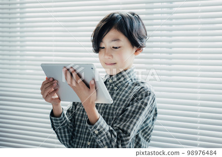 boy obsessed with tablet boy obsessed with tablet 98976484