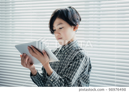 boy obsessed with tablet boy obsessed with tablet 98976498