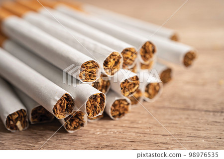 Cigarette, tobacco in roll paper with filter tube, No smoking concept. Cigarette, tobacco in roll paper with filter tube, No smoking concept. 98976535