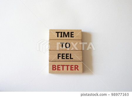 Time to feel better symbol. Wooden blocks with words Time to feel better. Beautiful white background. Medicine and Time to feel better concept. Copy space. 98977163