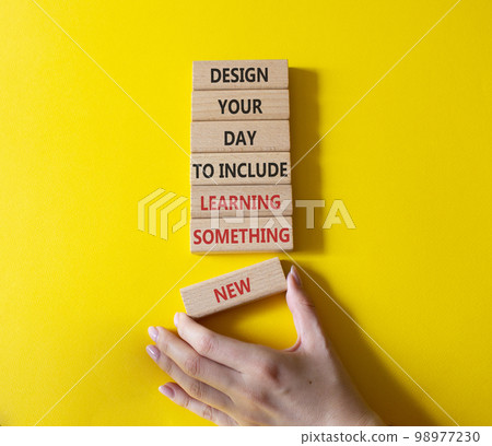 Learning symbol. Wooden blocks with words Design your day to learn something new. Businessman hand. Beautiful yellow background. Business and Learning concept. Copy space. Learning symbol. Wooden blocks with words Design your day to learn something new. Businessman hand. Beautiful yellow background. Business and Learning concept. Copy space. 98977230