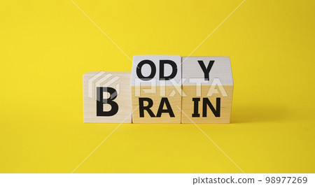 Body vs Brain symbol. Turned Wooden cubes with words Brain and Body. Beautiful yellow background. Business and Body vs Brain concept. Copy space. Body vs Brain symbol. Turned Wooden cubes with words Brain and Body. Beautiful yellow background. Business and Body vs Brain concept. Copy space. 98977269