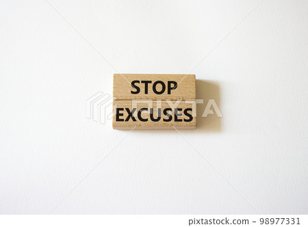 Stop excuses symbol. Concept words Stop excuses on wooden blocks. Beautiful white background. Business and Stop excuses concept. Copy space. 98977331