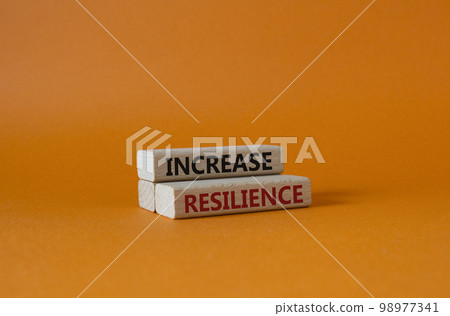 Increase resilience symbol. Wooden blocks with words Increase resilience. Beautiful orange background. Business and Increase resilience concept. Copy space. 98977341