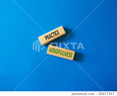 Practice Mindfulness symbol. Concept words Practice Mindfulness on wooden blocks. Beautiful blue background. Medical and Psychology and Practice Mindfulness concept. Copy space. 98977347