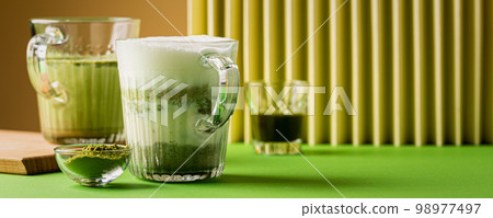 Matcha green tea latte in a glass Matcha green tea latte in a glass 98977497
