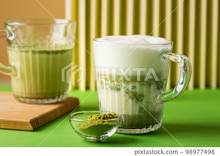 Matcha green tea latte in a glass Matcha green tea latte in a glass 98977498