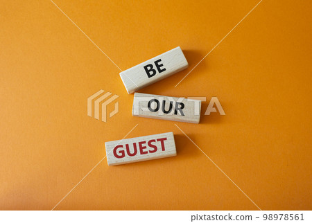 Be our guest symbol. Concept word Be our guest on wooden blocks. Beautiful orange background. Business and Be our guest concept. Copy space Be our guest symbol. Concept word Be our guest on wooden blocks. Beautiful orange background. Business and Be our guest concept. Copy space 98978561