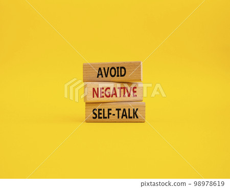 Avoid negative self-talk symbol. Concept words Avoid negative self-talk on wooden blocks. Beautiful yellow background. Business and Avoid negative self-talk concept. Copy space. Avoid negative self-talk symbol. Concept words Avoid negative self-talk on wooden blocks. Beautiful yellow background. Business and Avoid negative self-talk concept. Copy space. 98978619