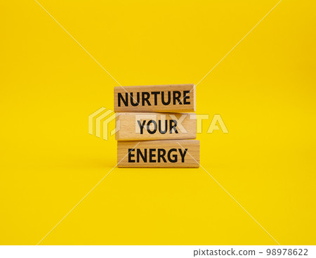 Nurture your Energy symbol. Concept words Nurture your Energy on wooden blocks. Beautiful yellow background. Business and Nurture your Energy concept. Copy space Nurture your Energy symbol. Concept words Nurture your Energy on wooden blocks. Beautiful yellow background. Business and Nurture your Energy concept. Copy space 98978622