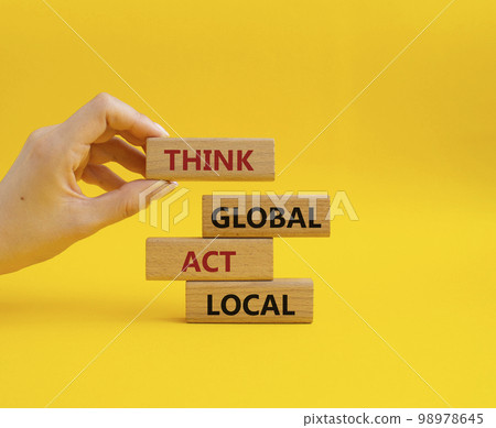 Think global act local symbol. Wooden blocks with words Think global act local. Beautiful yellow background. Businessman hand. Business and Think global act local concept. Copy space. Think global act local symbol. Wooden blocks with words Think global act local. Beautiful yellow background. Businessman hand. Business and Think global act local concept. Copy space. 98978645