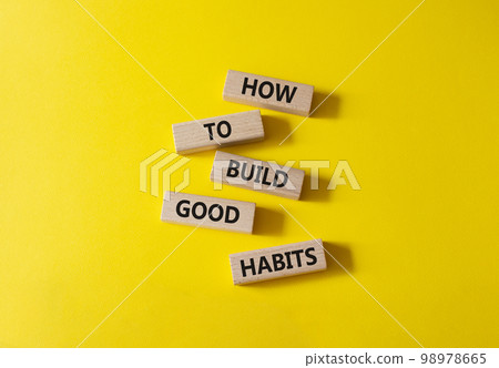 How to build good credit symbol. Concept words How to build good credit on wooden blocks. Beautiful yellow background. Business and How to build good credit concept. Copy space. 98978665