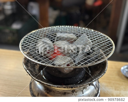 Adding charcoal outlet to grill