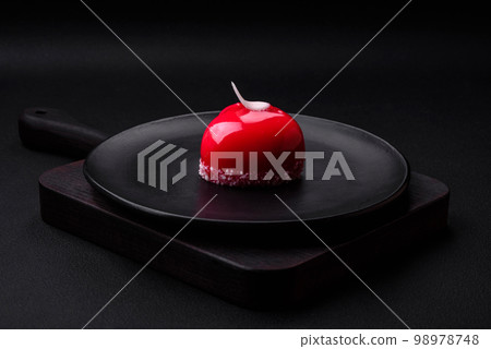 Beautiful tasty cake red color cheesecake in the shape of a heart Beautiful tasty cake red color cheesecake in the shape of a heart 98978748