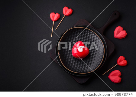 Beautiful tasty cake red color cheesecake in the shape of a heart 98978774