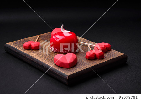 Beautiful tasty cake red color cheesecake in the shape of a heart 98978781