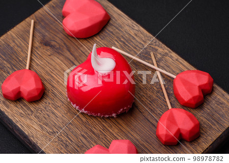 Beautiful tasty cake red color cheesecake in the shape of a heart 98978782
