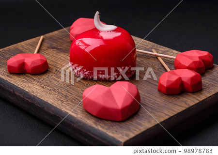 Beautiful tasty cake red color cheesecake in the shape of a heart Beautiful tasty cake red color cheesecake in the shape of a heart 98978783