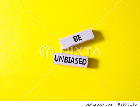 Be Unbiased symbol. Wooden blocks with words Be Unbiased. Beautiful yellow background. Business and Be Unbiased concept. Copy space. 98979180