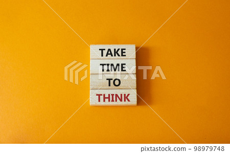 Take time to think symbol. Wooden blocks with words Take time to think. Beautiful orange background. Business and Take time to think concept. Copy space. 98979748